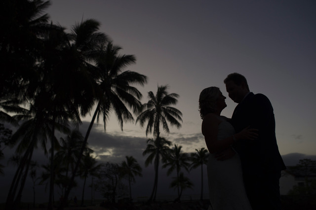 Wedding couple in Port Douglas at  sunset beside St Mary's By The Sea